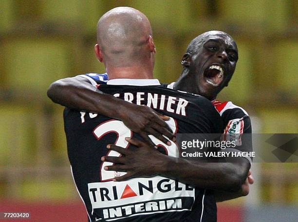 Nancy's defender Sebastien Puygrenier and forward Marc Antoine Fortune jubilate after their team scored a goal during their French L1 football match...