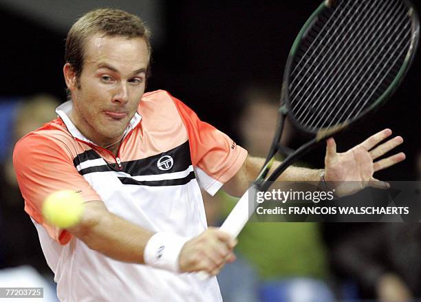 Belgian Olivier Rochus hits a shot to Romanian Andrei Pavel during their ATP "Ethias Trophy" in Mons, 05 October 2007. AFP PHOTO / BELGA PHOTO /...