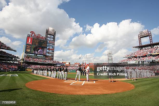 Clint Hurdle, manager of the Colorado Rockies and Charlie Manuel, manager of the Philadelphia Phillies shake hands prior to the game one of the...
