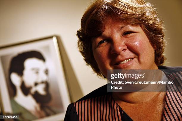 Aleida Guevara March, daughter of Ernesto Che Guevara, poses in front of an image of her father October 5, 2007 in Havana, Cuba. Che Guevara was...