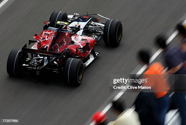 Sebastian Vettel of Germany and Scuderia Toro Rosso drives during qualifying for the Chinese Formula One Grand Prix at the Shanghai International...