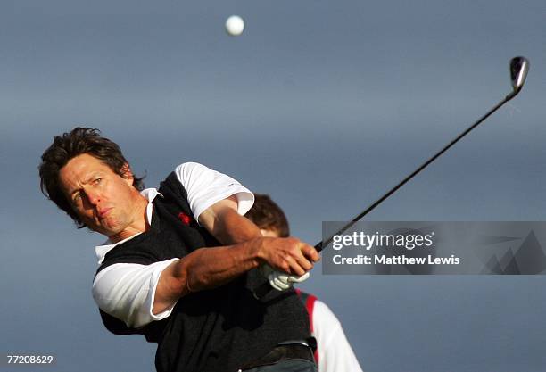 Film actor Hugh Grant plays his second shot on the fourth hole during the third round of The Alfred Dunhill Links Championship at Kingsbarns Golf...