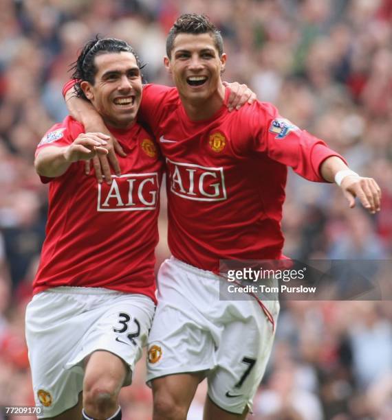 Carlos Tevez of Manchester United celebrates scoring their first goal during the Barclays FA Premier League match between Manchester United and Wigan...