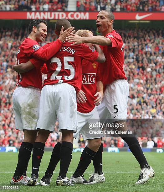 Danny Simpson is congratulated for his part in Wayne Rooney of Manchester United scoring their fourth goal during the Barclays FA Premier League...