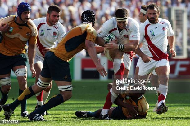 Andrew Sheridan of England is tackled by George Gregan and Daniel Vickerman of Australia during the Quarter Final of the Rugby World Cup 2007 between...