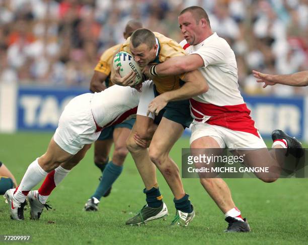 Australia's fullback Chris Latham fights for the ball with England's prop and captain Phil Vickery during the rugby union World Cup quarter final...