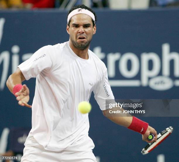 Colombian Alejandro Falla hits a ball to Latvian Ernests Gulbis during their semi-final match at the ATP Challenger Tennis Tournament 'Ethias...