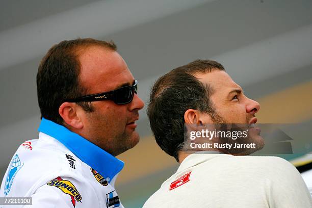 Jacques Villeneuve , driver of the unicef Toyota, stands by his car with his crew chief, Richard "Slugger" Labbe during qualifying for the NASCAR...