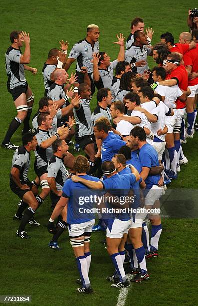 The New Zealand team perform The Haka whilst confronted by the France team wearing shirts representing the national flag before the Quarter Final of...
