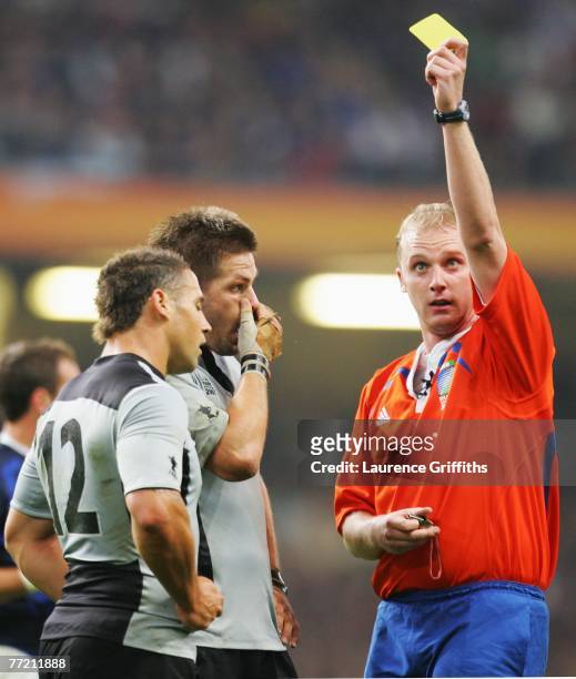 Referee Wayne Barnes of England sends Luke McAlister of New Zealand to the sin bin during the Quarter Final of the Rugby World Cup 2007 match between...