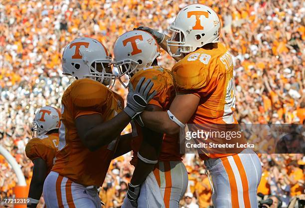 Arian Foster celebrates with teammate Luke Stocker of the Tennessee Volunteers celebrates a touchdown against the Georgia Bulldogs during their game...