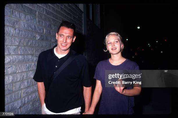 Actress Drew Barrymore and her husband Jeremy Thomas attend the premiere of "Bad Girls" April 19, 1994 in Los Angeles, CA. The film tells the story...