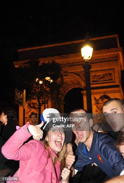 Supporters of the French rugby union team jubilate after the world cup quarter-final between New Zealand and France, 06 October 2007 on the...