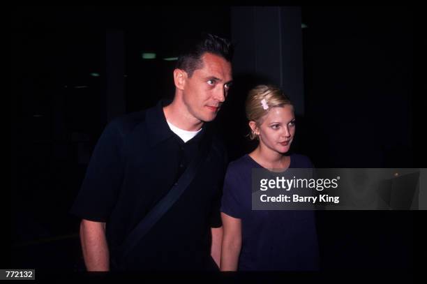 Actress Drew Barrymore and her husband Jeremy Thomas attend the premiere of "Bad Girls" April 19, 1994 in Los Angeles, CA. The film tells the story...