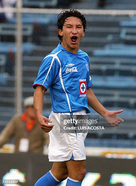 Cruz Azul's Cesar Villaluz celebrates his goal against Monterrey during their Mexican League opening tournament match in Mexico City, 06 October...