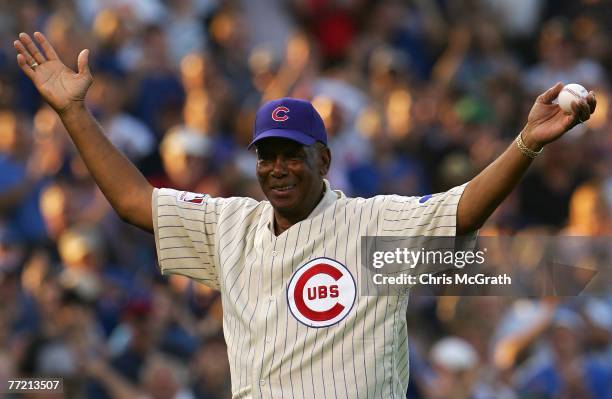 Baseball Hall of Famer and former Chicago Cub Ernie Banks acknowledges the fans prior to throwing out the ceremonial first pitch prior to Game Three...