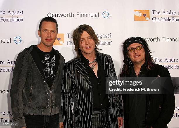 Musicians Mike Malinin, Johnny Rzeznik, and Robby Takac of the "Goo Goo Dolls" arrive at the Andre Agassi Charitable Foundation's 12th Annual Grand...