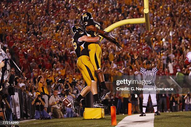 Chase Coffman of the Missouri Tigers is greeted by Danario Alexander after scoring a touchdown against the Nebraska Cornhuskers during 1st-half...