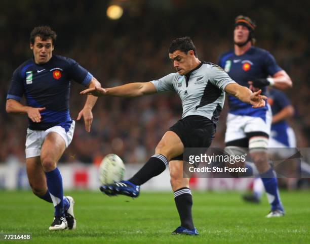 Dan Carter of New Zealand kicks forward during the Quarter Final of the Rugby World Cup 2007 match between New Zealand and France at the Millennium...