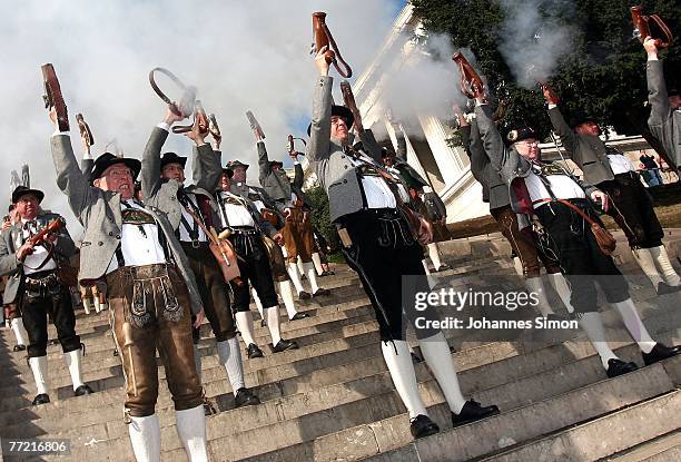 Traditionally dressed Bavarian riflemen fire a shot with their oneshot handguns during the last day of Oktoberfest beer festival on October 7, 2007...