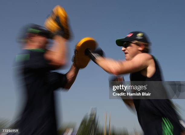 Brad Haddin of Australia boxes with strength and conditioning coach Justin Cordy during training at the Sector 16 Stadium on October 7, 2007 in...