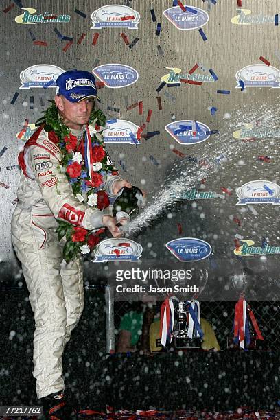 Allan McNish, driver of the Audi Sport North America Audi AG R10/TDI, celebrates in victory lane after winning the 10th Anniversary Petit Le Mans at...