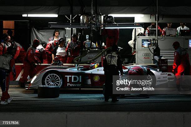 Emanuele Pirro and Marco Werner, drivers of the Audi Sport North America Audi AG R10/TDI, makes a pit stop during the 10th Anniversary Petit Le Mans...