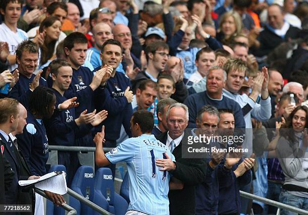 Sven-Goran Eriksson, manager of Manchester City, congratulates Elano of Manchester City after taking him from the ground during the Barclays Premier...