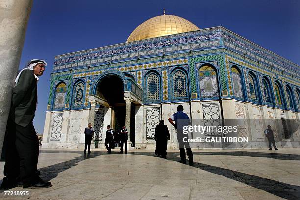 Palestinian worshipper waits outside the Dome of the Rock during Turkish Foreign Minister Ali Babacan's visit with his wife Zeyneb to the Al-Aqsa...