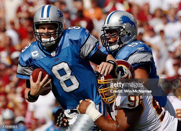 Detroit Lions quarterback Jon Kitna is sacked by Washington Redskins defensive tackle Cornelius Griffin in first quarter action at FedEx Field...