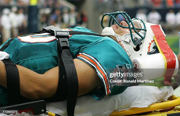 Quarterback Trent Green of the Miami Dolphins is taken off the field after an injury during play withthe Houston Texans at Reliant Stadium on October...