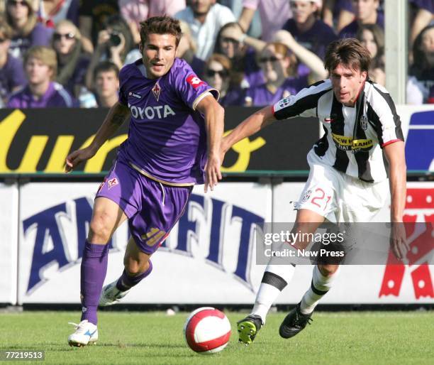 Adrian Mutu of Fiorentina in action against Zdenek Grygera of Juventus during the Serie A match between Fiorentina and Juventus at the Stadio Artemio...