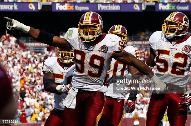 Washington Redskins defensive end Andre Carter celebrates after sacking Detroit Lions quarterback Jon Kitna for a safety in third quarter action at...