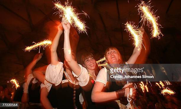 Waitresses celebrate the last evening of the Oktoberfest beer festival dancing on tables on October 7, 2007 in Munich, Germany. More than 6 Million...