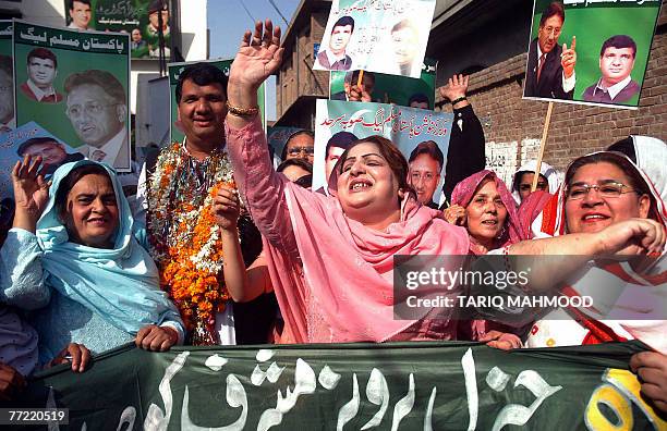 Women activists of the ruling Pakistan Muslim League-Quaid celebrate President Pervez Mushrraf's win in the presidential election, in Peshawar 07...