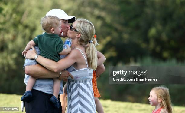 Justin Leonard kisses his wife Amanda and their children after winning the Valero Texas open at LaCantera Golf Club October 7, 2007 in San Antonio,...