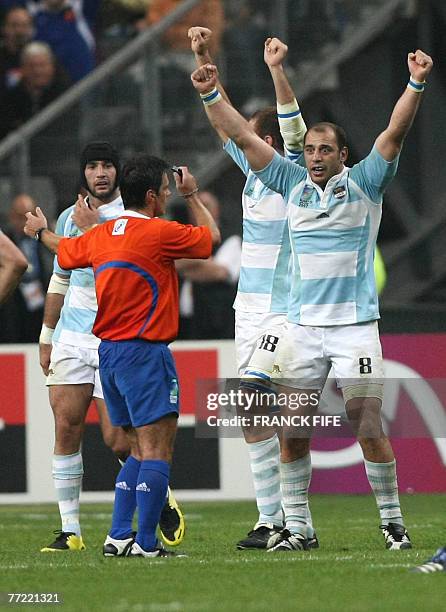 Argentina's N?8 Gonzalo Longo and Argentina's lock Rimas Alvarez Kairelis celebrate at the end of the Rugby union World Cup quarter final match...