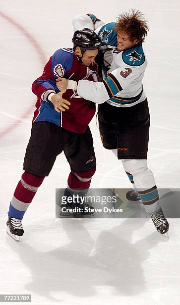 Ian Laperriere of the Colorado Avalanche fights with Douglas Murray of the San Jose Sharks in the third period of the hockey game on October 7, 2007...