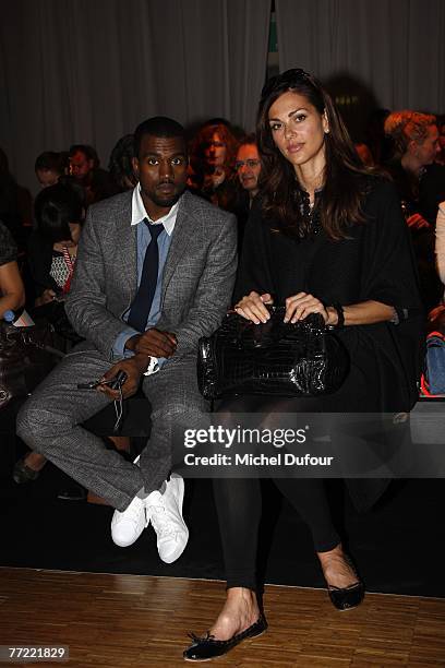 Kanye West and Tascha Vasconcelos attend the Collette Dinnigan fashion show, during the Spring/Summer 2008 ready-to-wear collection show on October...