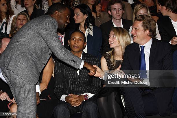 Kanye West, William Farrel, Delphine Arnault and Alessandro Vallarino Gancia attend the Louis Vuitton fashion show, during the Spring/Summer 2008...