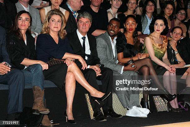 Elodie Bouchez, Catherine Deneuve, Yves Carcelle, Kanye West and his wife, Dita von Teese attends the Louis Vuitton fashion show, during the...