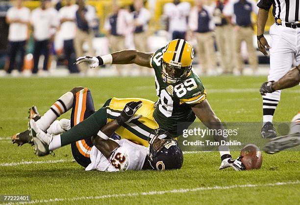 Wide receiver James Jones of the Green Bay Packers fumbles the ball in the first quarter at an NFL game against the Chicago Bears at Lambeau Field...