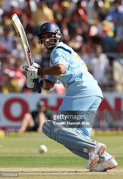 Sourav Ganguly of India runs the ball to third man during the fourth one day international match between India and Australia at the Sector 16 Stadium...