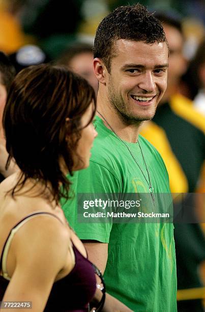 Actress Jessica Biel and singer Justin Timberlake stand on the sidelines before the Green Bay Packers verses the Chicago Bears at Lambeau Field...