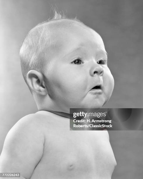 1950s BABY IN PROFILE WITH POMPOUS FACIAL EXPRESSION