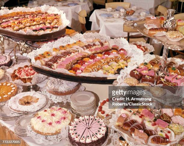 1960s RESTAURANT DESSERT BUFFET DISPLAY PASTRIES INCLUDING SWEETS CAKES PIES ECLAIRS PETITS FOURS