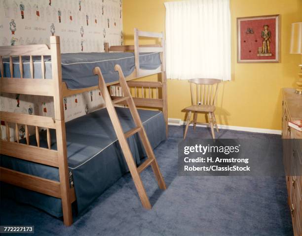 CHILDS BEDROOM BUNKBEDS BLUE CARPET YELLOW WALLS CHAIR DRESSER