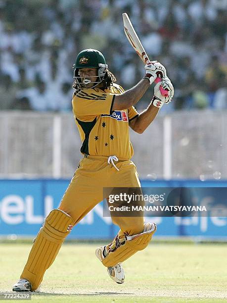 Australian cricketer Andrew Symonds plays a stroke during the fourth One-Day International match in Chandigarh 08 October 2007. Australia are...