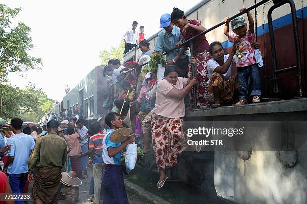 This picture taken 28 August 2007 shows passengers riding a train in Taung Pyone district near Mandalay, in central Myanmar. The Economist...