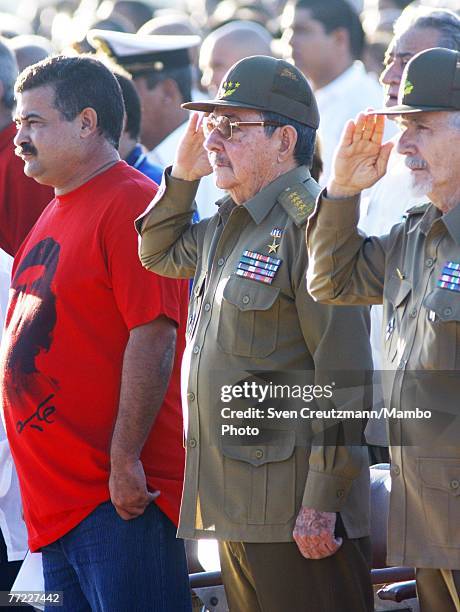 Raul Castro , Cuba's acting President, salutes during the national anthem during a commemoration of the 40th anniversary of the death of Ernesto Che...